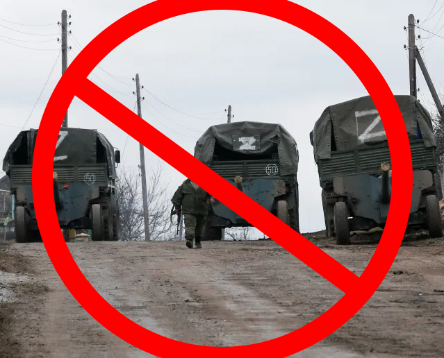 A photo of Russian military vehicles with a "Z" on them with a red "no" symbol superimposed